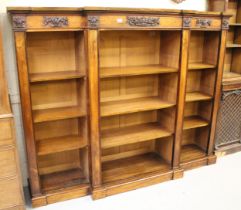 19th Century rosewood breakfront low bookcase, the moulded top with applied carved frieze above