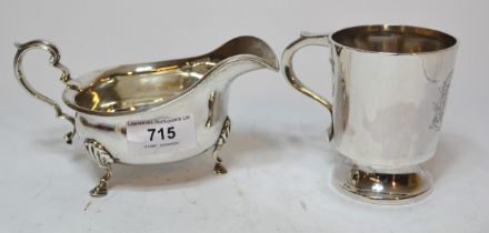 Silver helmet shaped cream jug with C-scroll handle and hoof supports, together with a Sheffield