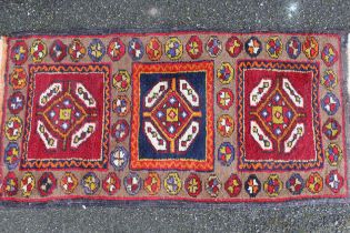 Small Afghan rug with triple medallion centre, 97 x 48cm