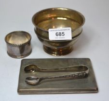 Birmingham silver pedestal bowl, silver napkin ring, pair of sugar tongs and a silver cigarette case