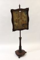 Victorian mahogany polescreen, the adjustable rectangular panel inset with a Victorian