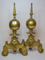Pair of 19th Century brass andirons on shaped supports with lion mask, 53cm high Need tightening but