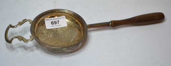 George III silver strainer with a turned wooden handle fitting for the handle is not hallmarked &