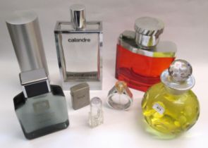 Collection of five large shop display perfume bottles including Paco Rabanne and three smaller