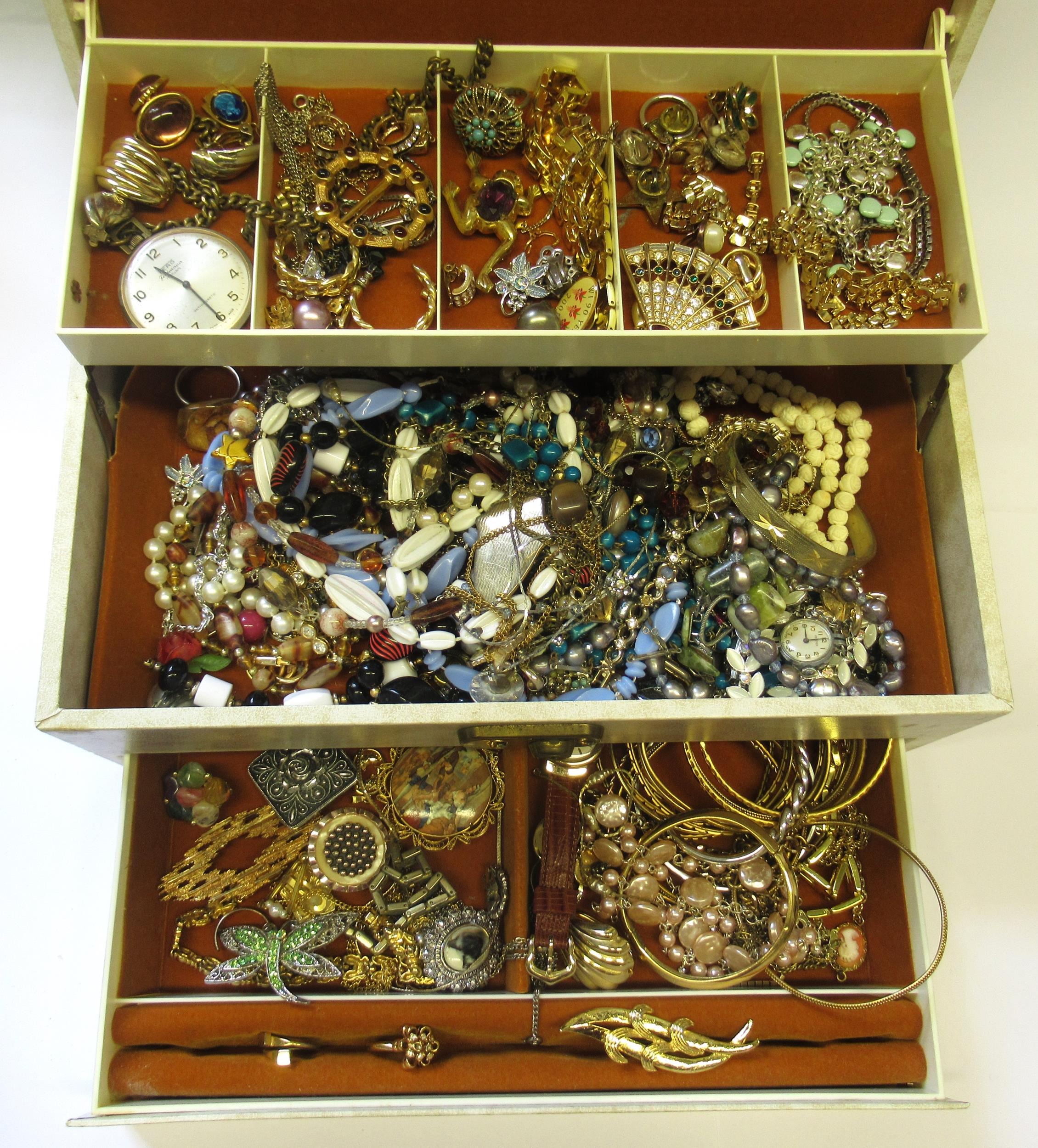 Cream jewellery box containing a quantity of various costume jewellery