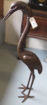 Patinated bronze standing figure of a heron, 92cm high