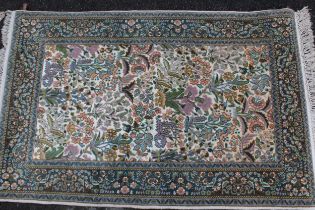 Small Indo Persian rug of Persian design with a floral pattern on an ivory ground with borders,