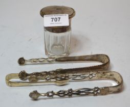 Three pairs of silver sugar tongs and a silver mounted salts bottle Two pairs of sugar tongs are