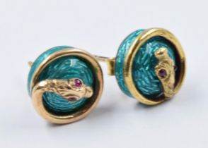 Pair of 9ct gold and enamel circular stud earrings mounted with serpents, having ruby inset eyes