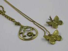 18ct Gold pendant on an 18ct gold chain, 11.8g, together with another 18ct gold chain and two yellow