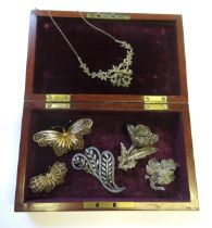 Quantity of marcasite set brooches, various filigree work butterfly brooches with a similar bracelet