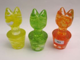 Group of three Kosta Boda tulip form candle holders, in orange, green and yellow, 16cm high