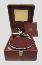 HMV table top wind-up gramophone, retailed by Harrods, having a red case (handle at fault)