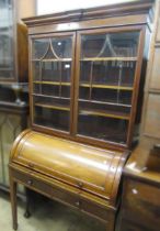 Edwardian mahogany cylinder bookcase having moulded cornice above two glazed doors, the cylinder top