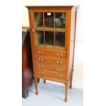 Edwardian mahogany and line inlaid music cabinet, the single bar glazed door with single shelf above