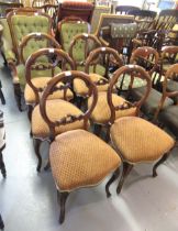 Set of six Victorian carved walnut balloon back dining chairs with carved and pierced centre