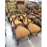 Set of six Victorian carved walnut balloon back dining chairs with carved and pierced centre