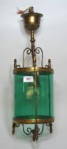 Early 20th Century brass hanging circular hall lantern with green glass shade, 52cm high In good