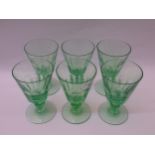 Set of six pale green tinted glass pedestal goblets