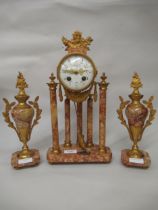 French rouge marble and ormolu mounted three piece clock garniture having circular enamel dial