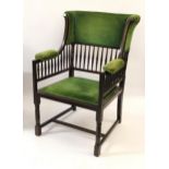 Arts and Crafts mahogany wing armchair with upholstered and spindle back above a padded seat and