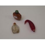 Group of three various Chinese moulded glass snuff bottles Various small chips to all three bottles