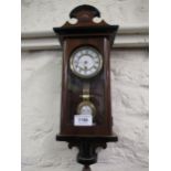 Miniature Continental walnut cased Vienna style wall clock, the enamel dial with Roman numerals