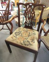 George III mahogany open armchair with a pierced splat back, shaped arms, needlepoint drop-in seat