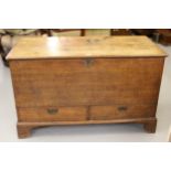 George III oak mule chest with a hinged cover above two drawers raised on bracket feet, 114 x 54 x