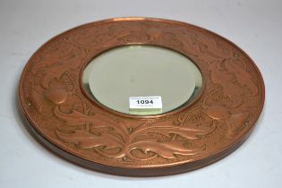 Keswick School of Industrial Arts, circular repousse copper wall mirror, signed W.H. Wilson, 30.