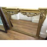 Reproduction gilt framed wall mirror with floral swags and bevelled plate, 98 x 124cm wide