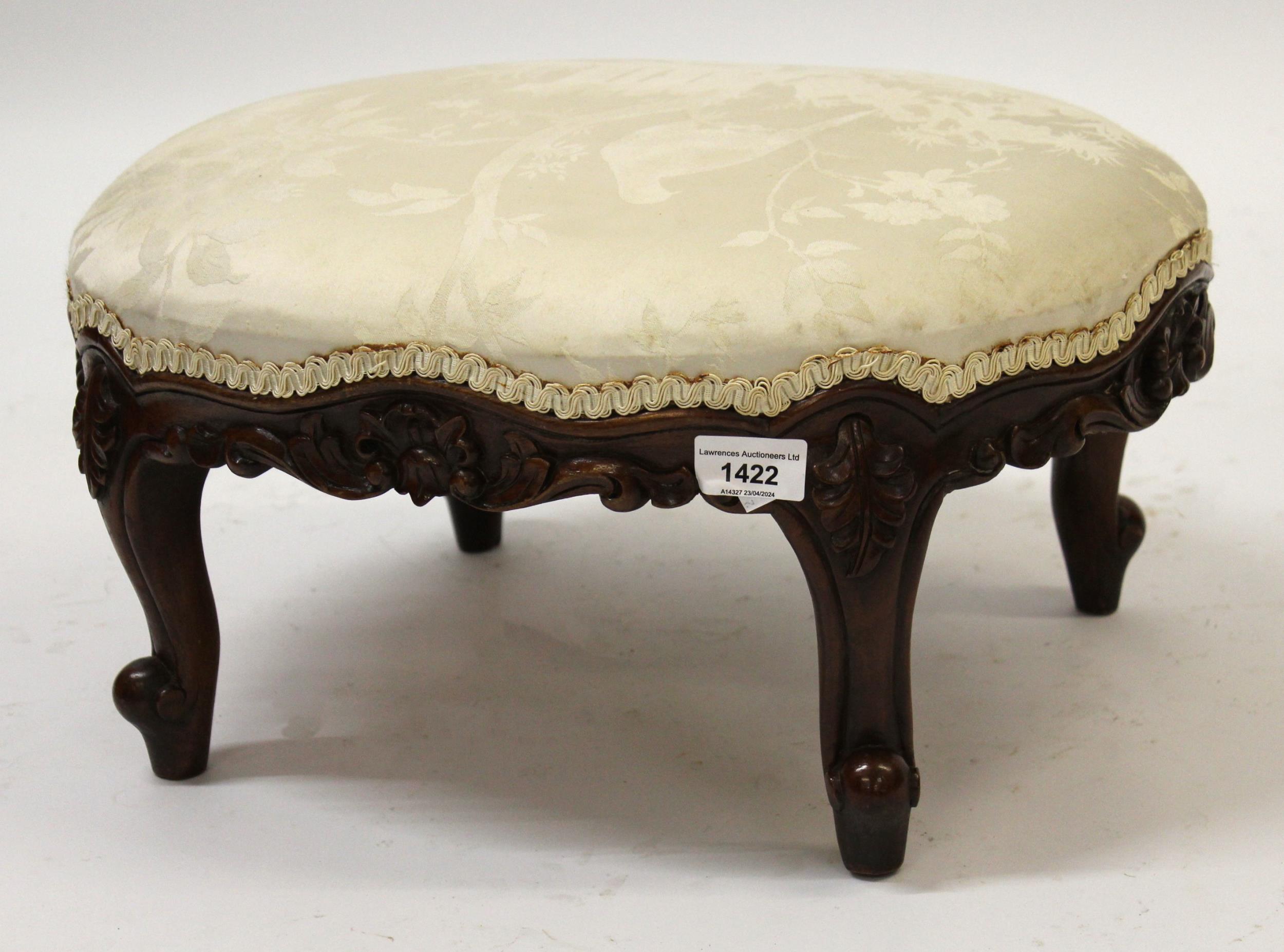 Oval carved mahogany foot stool, together with a small oval gilt wall mirror and a floral painted