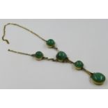 Gold mounted pendant necklace set five cabochon jade stones (chain at fault)