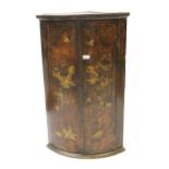 18th Century chinoiserie lacquer bow fronted hanging corner cabinet, decorated with pagodas and