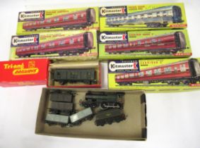Small box containing a quantity of boxed rolling stock and carriages including a Tri-ang engine