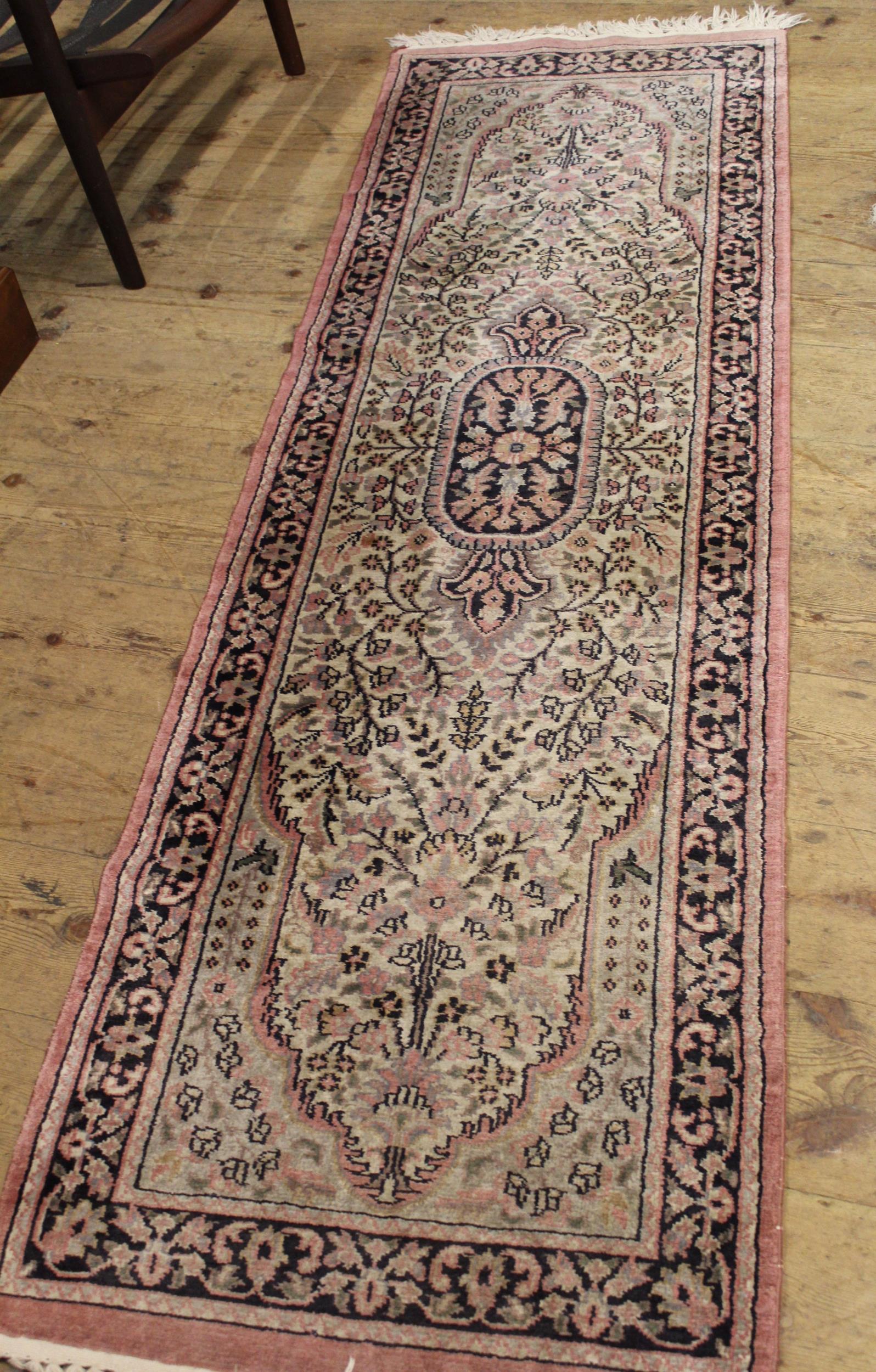 Indian rug with a medallion and all-over floral design on a rose ground with borders, together - Image 2 of 2