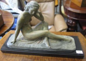 20th Century patinated spelter figure of a seated female nude on a black marble plinth, 59 x 35cm