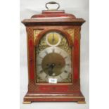 Scarlet chinoiserie lacquer bracket clock, the pagoda case enclosing an arched dial, the silvered