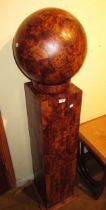 Large modern burr wood sculpture in the form of a ball mounted on a rectagular column, 143cm high