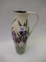 Modern Moorcroft jug with typical decoration in the form irises on a pale ground, 2004, 28cm high
