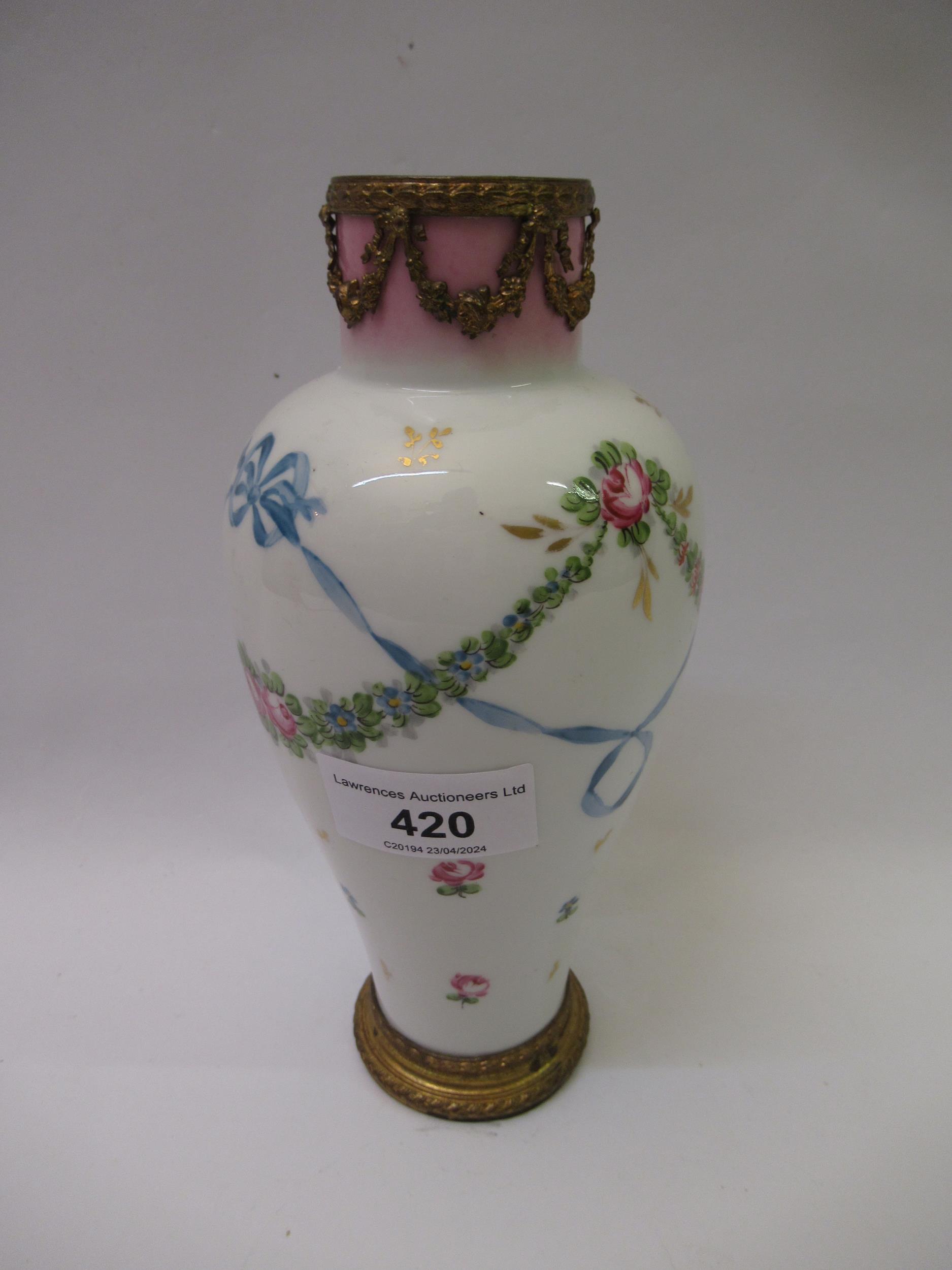 French Sevres style porcelain baluster form vase with gilt metal mounts, with all over floral and