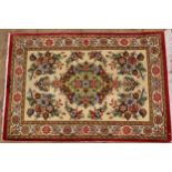 Small modern oriental silk rug with a medallion and floral spring design on an ivory ground with