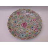 Chinese famille rose shallow dish, all-over floral decorated, 33cm diameter Some minor chips as