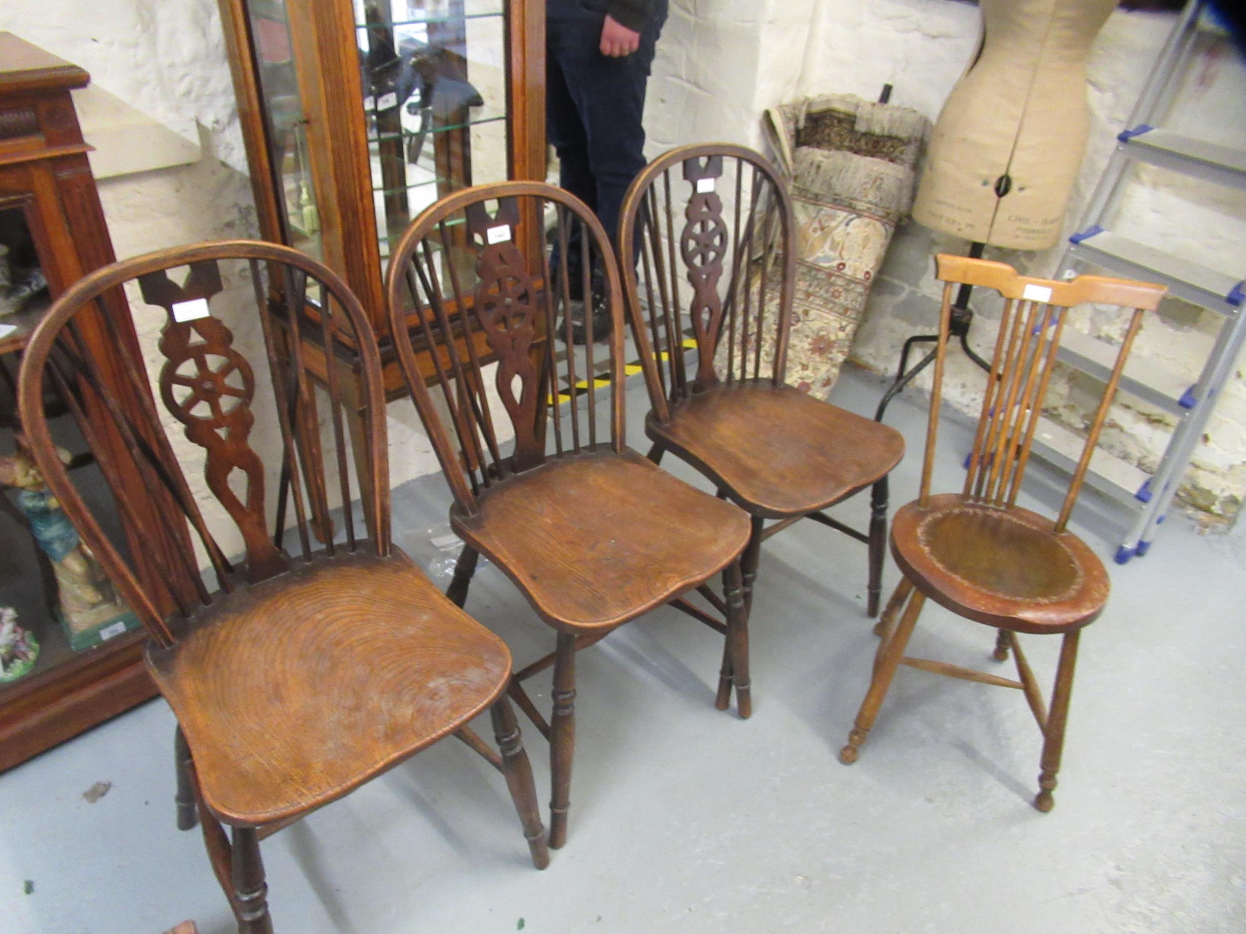 Set of three wheelback dining chairs and another stickback chair