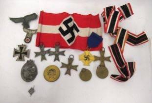 Quantity of German Third Reich badges, medals and medallions, including a Panzer assault badge,