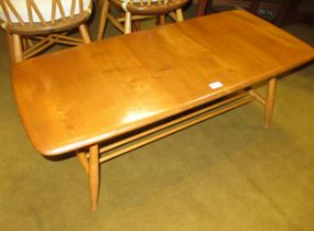 Ercol (unmarked) light ash coffee table, on splayed supports, with undertier, 36cm high x 104cm long