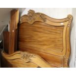 19th Century French walnut king size bed having carved decoration and plain side rails, with base (