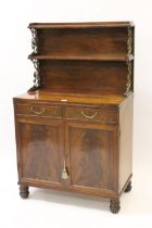 Small George IV mahogany chiffonier with a two tier shelf back supported by ormolu uprights above