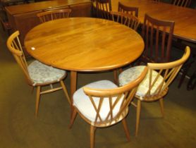 Ercol light ash circular drop-leaf dining table, on splayed supports, 72cm high x 113cm diameter,