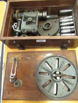 19th / early 20th Century iron and steel lathe type machine, housed in a mahogany case
